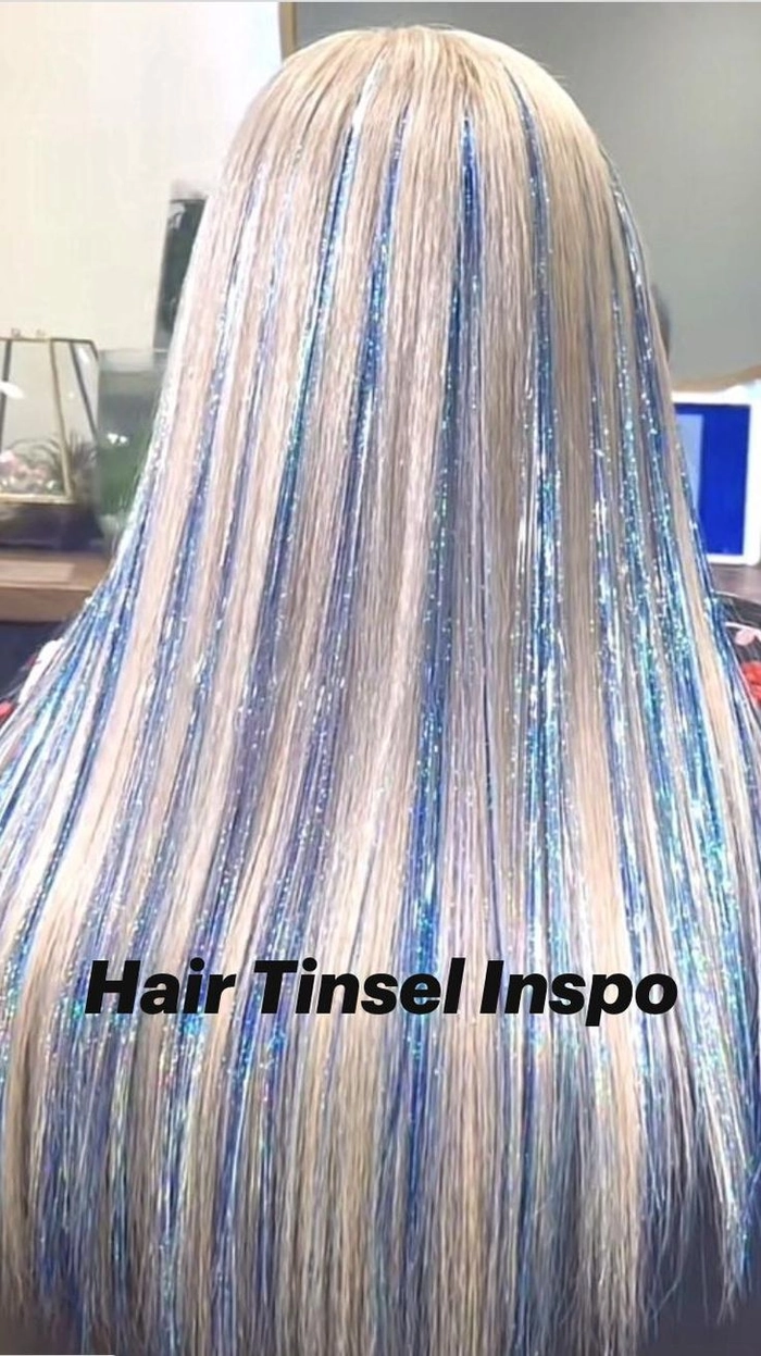 Festival hairstyle with hair tinsel braided into loose waves