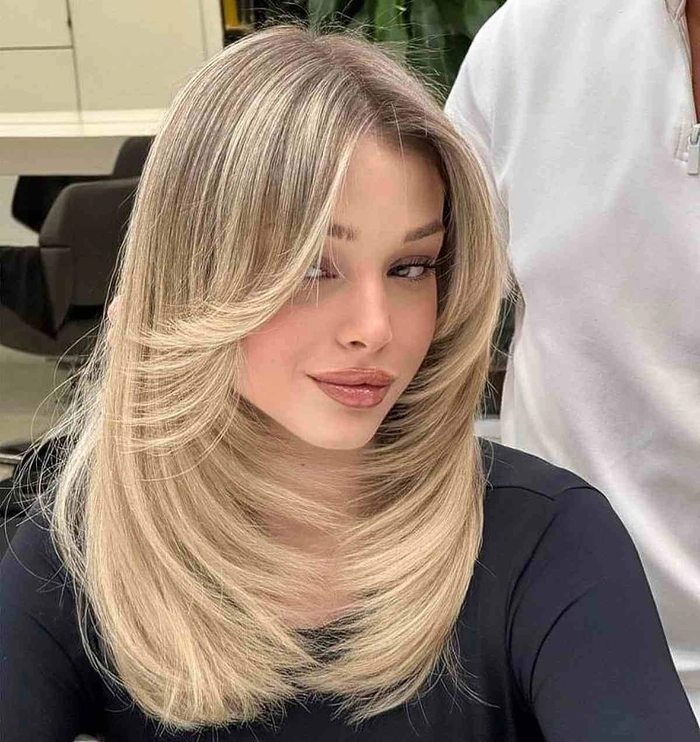 Stylish bohemian braided updo perfect for heart shaped faces at outdoor festivals Festival hairstyle for heart shaped face with side braids and floral accents