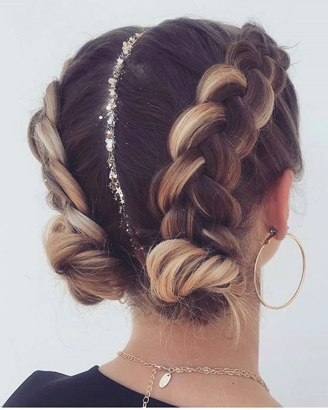 Trendy festival look featuring jewel-accented braided updo for summer Festival hairstyle with sparkling jewels woven into intricate braids