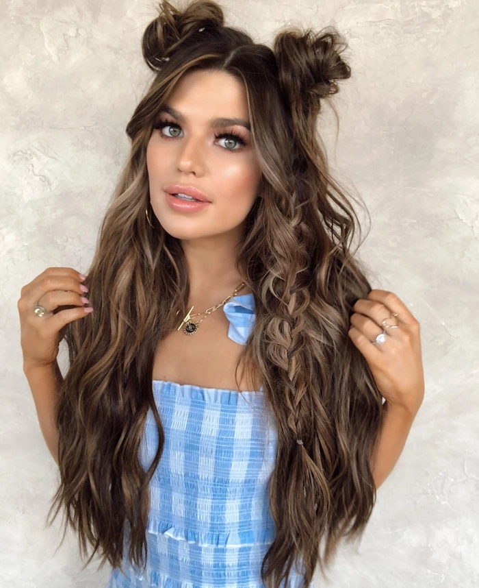 Festival hairstyle for medium length hair with a braided crown and small daisy accents