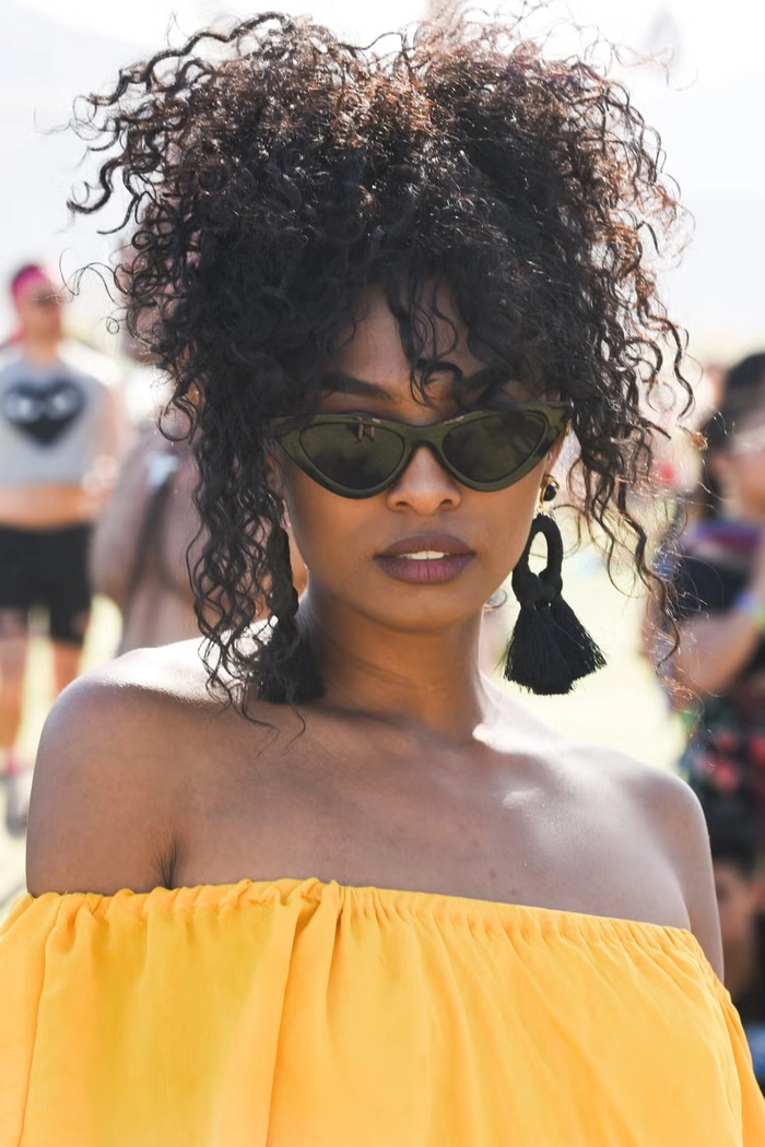 Festival Hairstyles for Natural Black Hair: Image 6 Updo Style Bold festival updo with natural black hair and accessories
