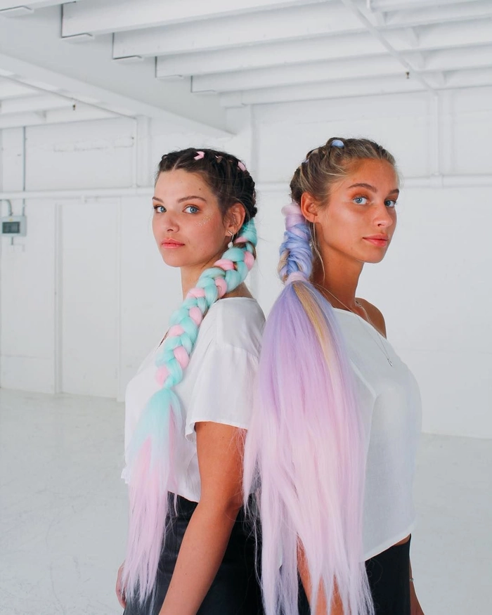 Festival Hairstyle with Pastel Hair Woman with pastel pink and blue hair styled in an intricate braided updo for a festival