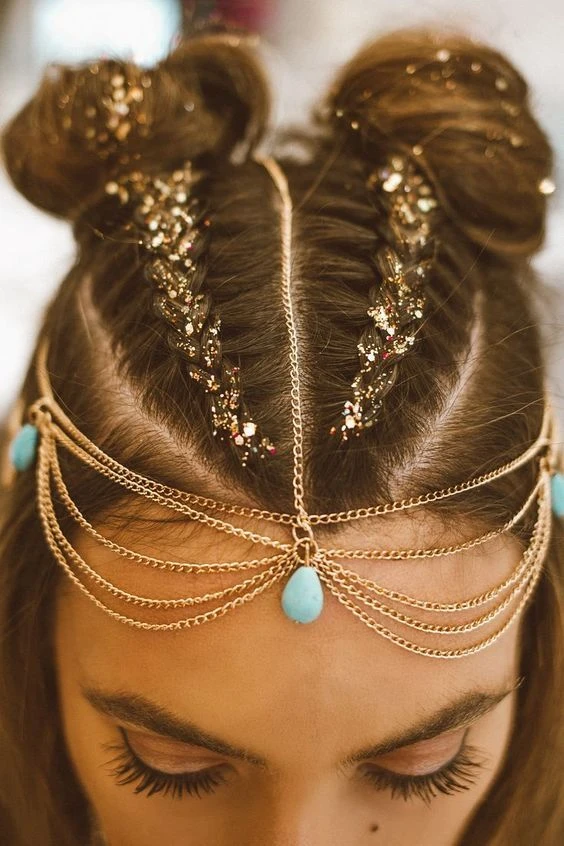 Fun festival look with temporary color hair streaks Bright temporary pink and purple festival hairstyle in a braided updo
