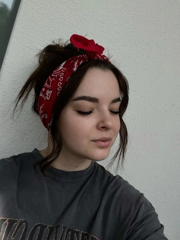Bohemian braided crown accented with a colorful bandana Festival hairstyle with a bandana wrapped around a messy bun