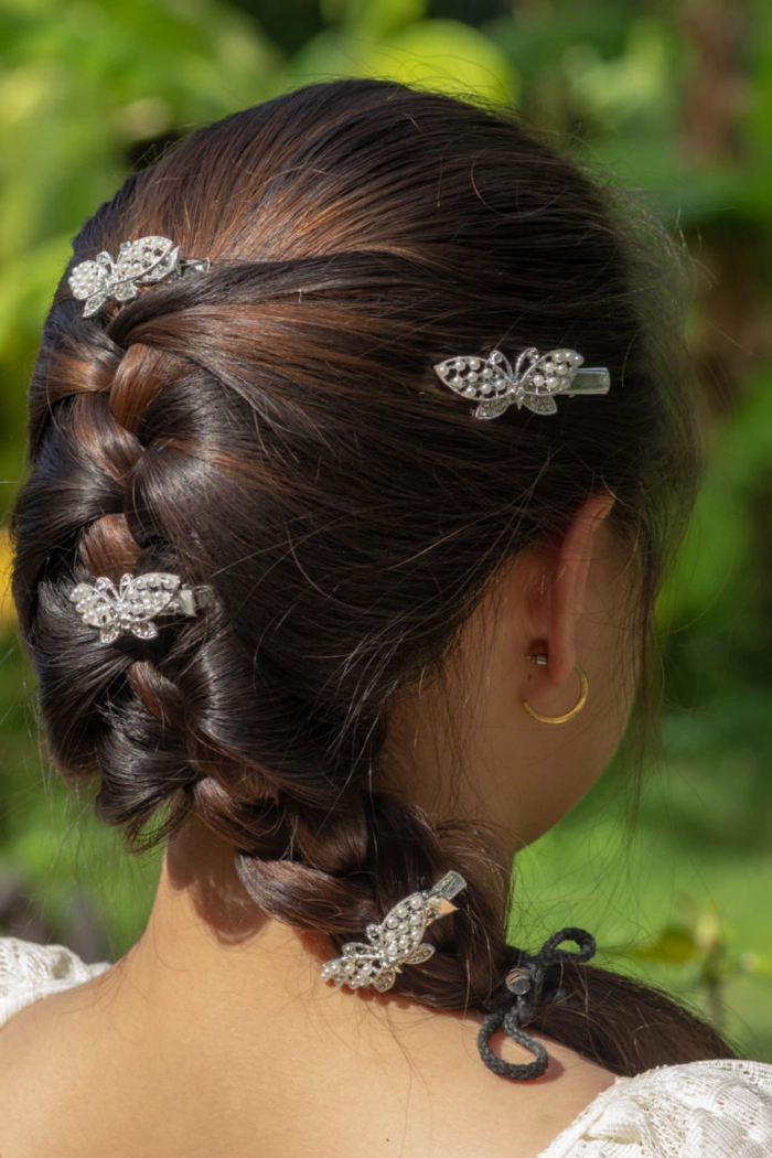 Colorful butterfly clip hairstyle perfect for outdoor festivals Festival hairstyles with butterfly clips in a playful braided updo
