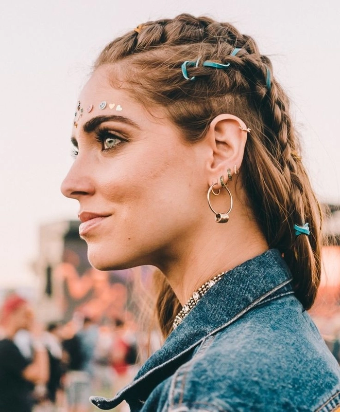 Festival hairstyle with a gold crown and loose braids