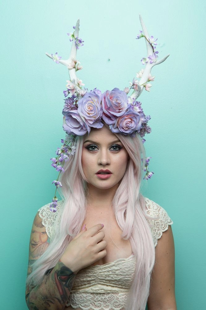 Festival crown hairstyle with braided updo and wispy tendrils