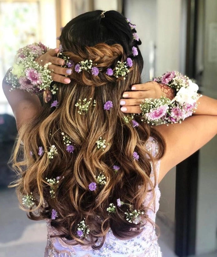 Boho braided updo with white daisies and lavender sprigs