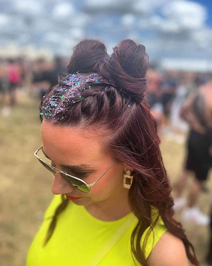 A festival hairstyle with vibrant highlights and braided accents