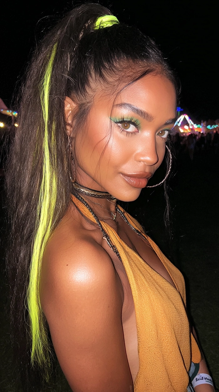 Festival hairstyle with bright highlights and flower accents