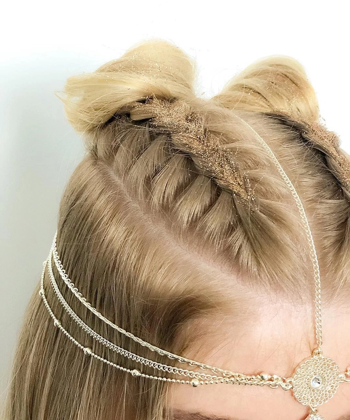Festival Hairstyles with Jewels - Image 6: Intricate braided updo featuring gemstone embellishments Bohemian festival hairstyle adorned with sparkling jewels and delicate floral accents