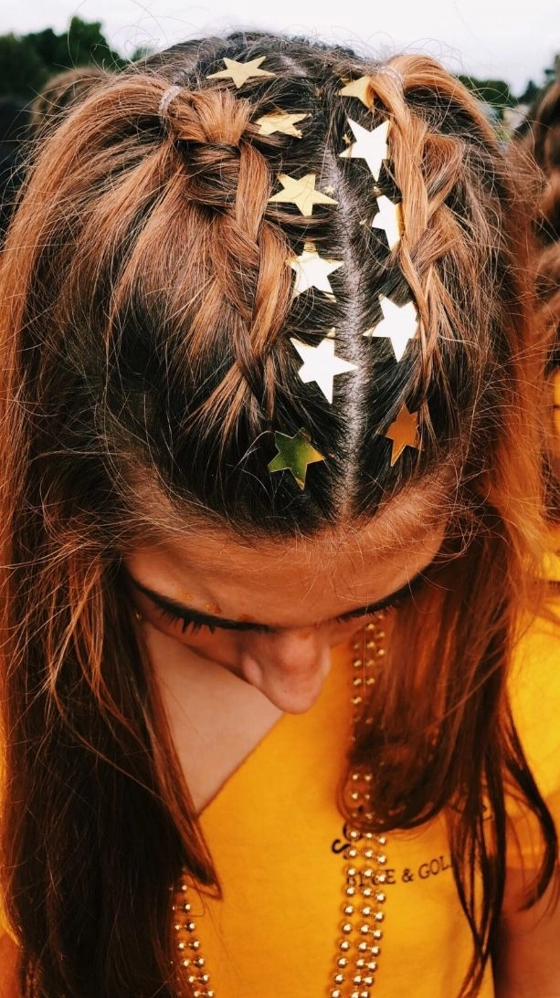 Stylish jeweled festival hairdo for summer music events Festival hairstyle with shimmering jewels braided into the hair