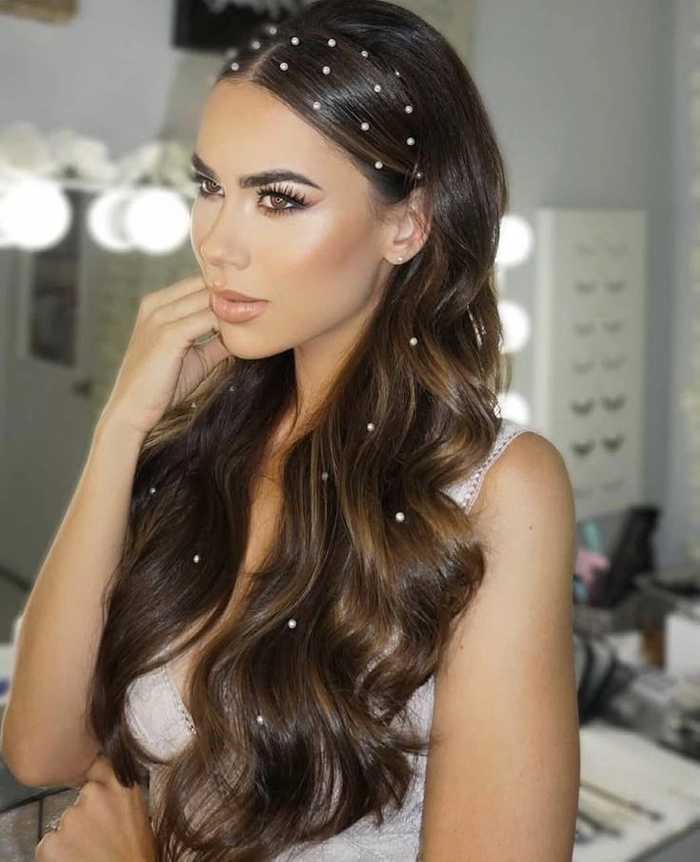 Festival Hairstyle 6 - Pearl Embellished Braided Updo Festival hairstyle with pearls woven through braided waves