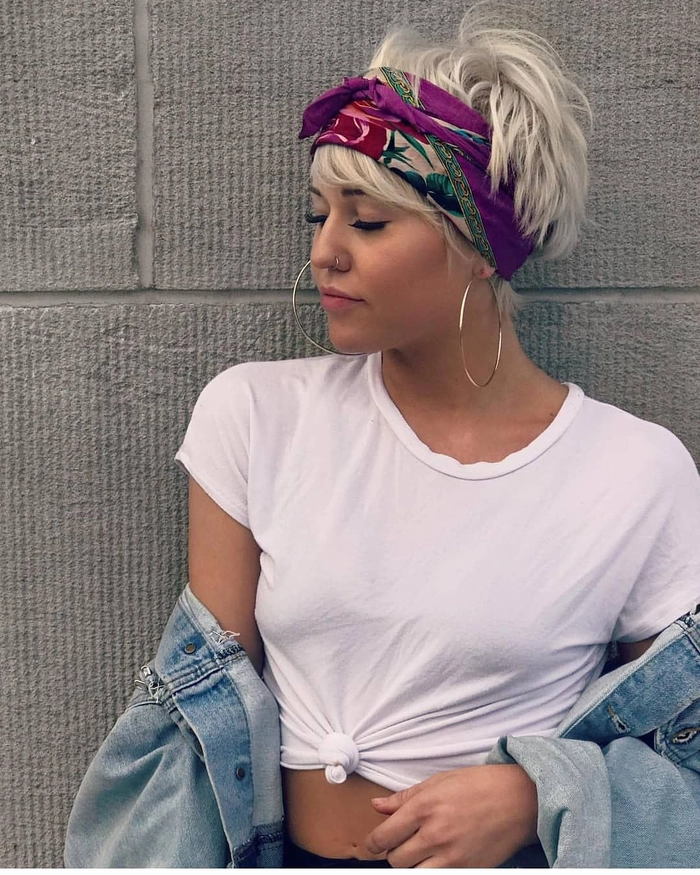 Model showcasing a trendy festival hairstyle with a patterned scarf