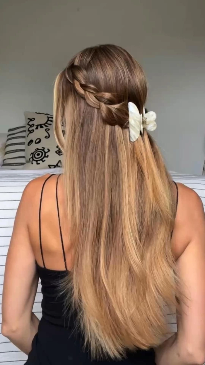 Festival half up half down hairstyle with braids and floral details