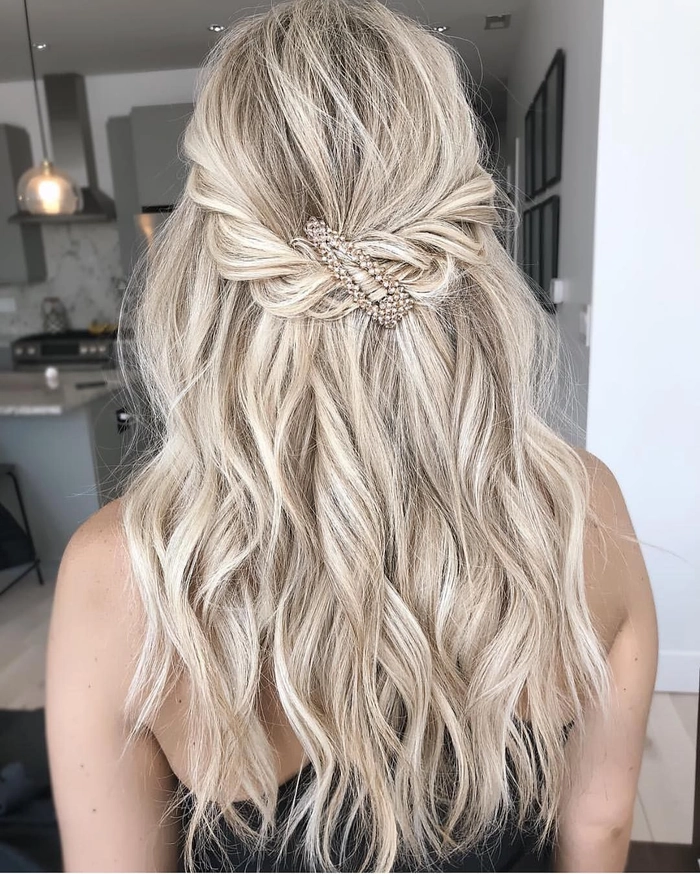 Festival half up half down hairstyle with braided crown and wildflowers
