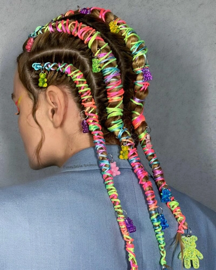 Trendy festival mohawk hairstyle with vibrant dyes and festival accessories Festival attendee with a bold mohawk hairstyle featuring colorful spikes and glitter accents
