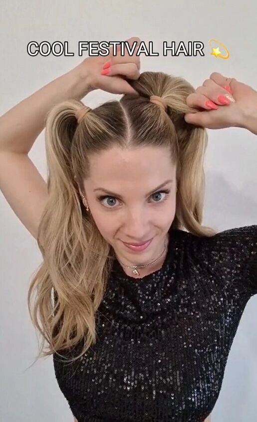 Festival pigtail hairstyle with colorful braids and flower accessories