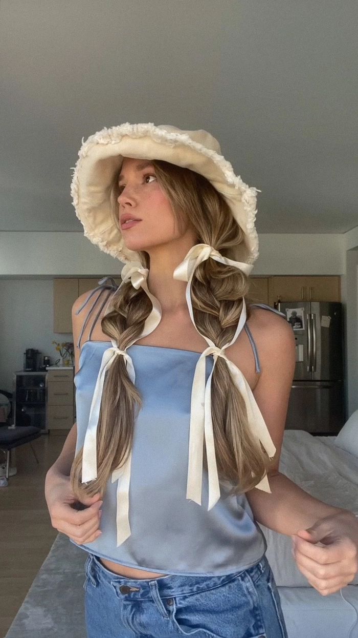 Festival pigtail hairstyles with colorful braids and beads for a fun music festival look