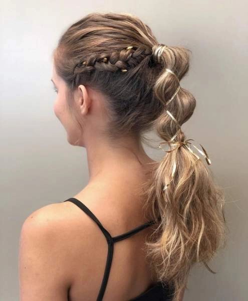 Festival ponytail hairstyle with textured waves and hair accessories