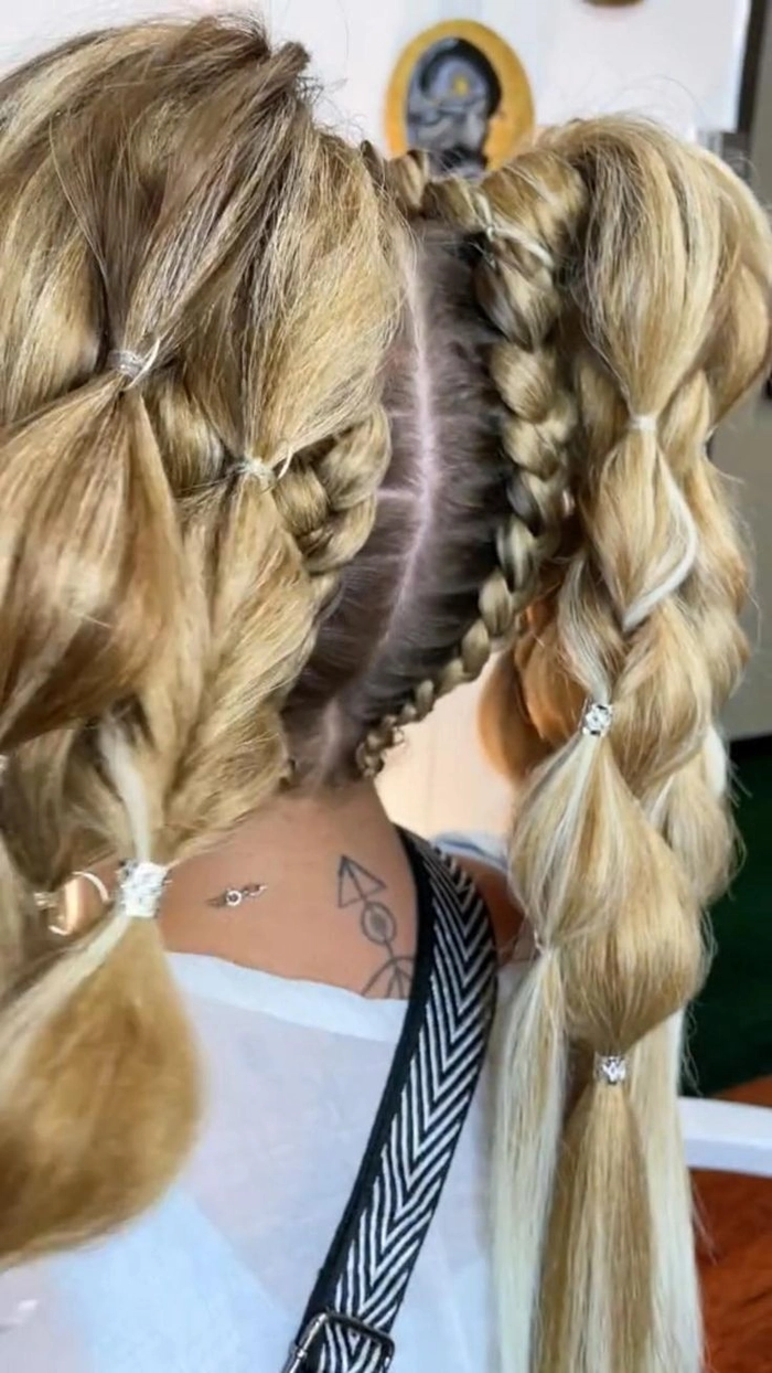 Woman wearing a festival ponytail hairstyle with braided accent and bandana