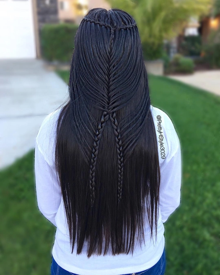 Bohemian festival waterfall braid adorned with wildflowers and gold threads Festival waterfall braid hairstyle with cascading waves and shimmering hair jewels