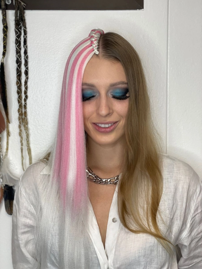 Waterfall braid festival hairstyle example with bohemian accessories Festival waterfall braid hairstyle with floral accents and waves