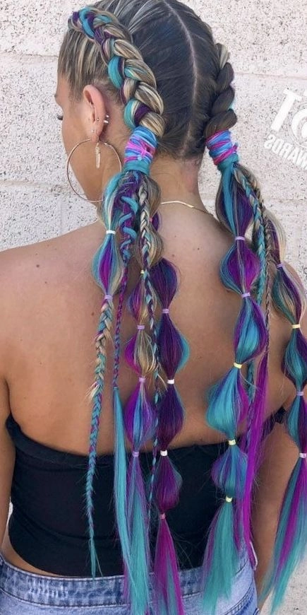 Quick five minute festival hairstyle with braids and floral accents