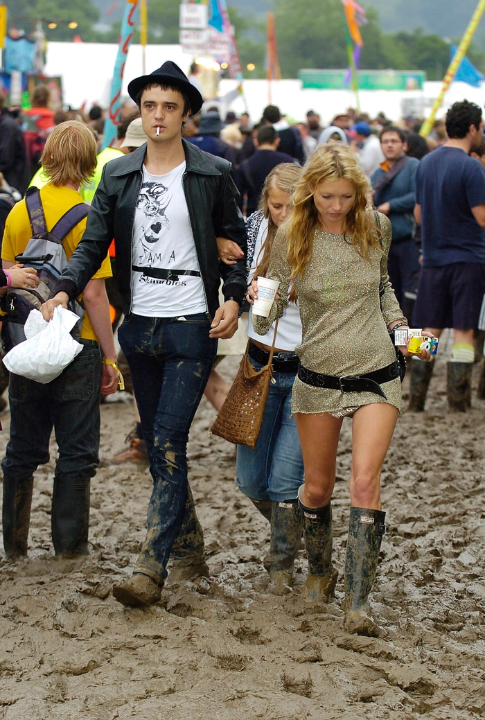 Three women with flower crowns and messy braided Glastonbury hairstyles