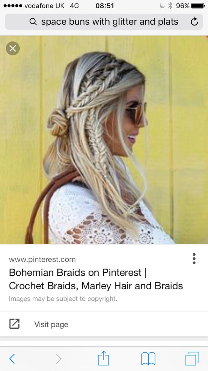 Braided updo with flowers and glitter at Glastonbury 2024