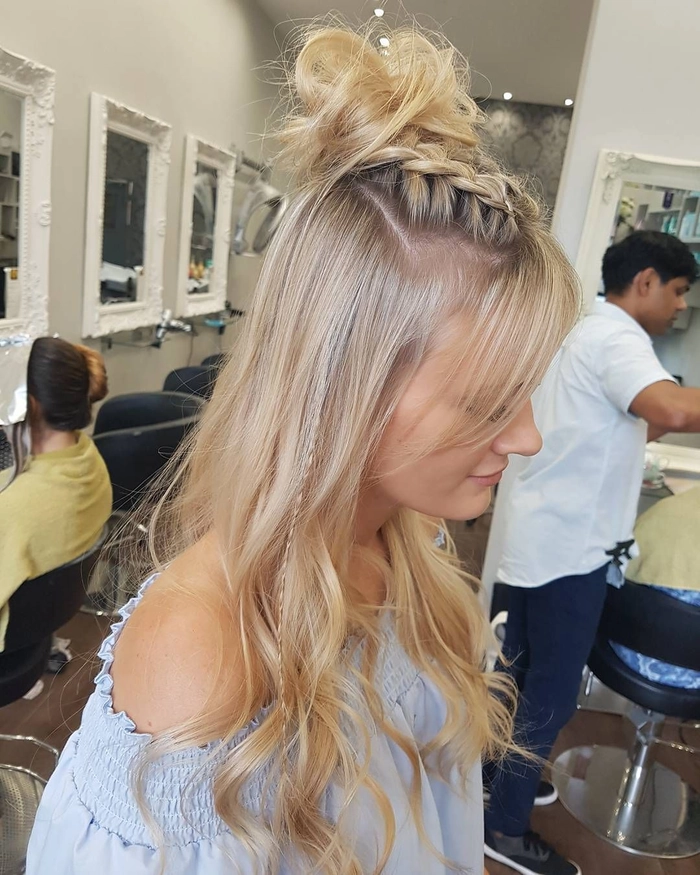 Glastonbury festival hairstyle with braided flowers and colorful accessories