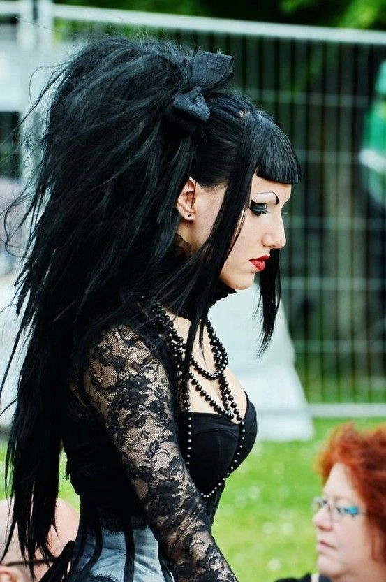 Edgy gothic hairstyle with braids and black accessories for a festival look