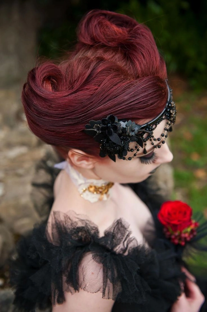 Edgy gothic festival hairstyle with braids and dark accessories