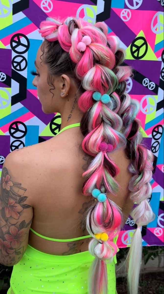 Festival hairstyle featuring braided ponytails with bead embellishments Girl with vibrant braids and beads smiling at a festival