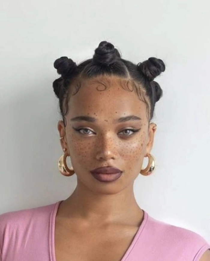 Lollapalooza festival hairstyle with braided crown and flower accents Edgy braided updo with colorful accessories for Lollapalooza festival hair