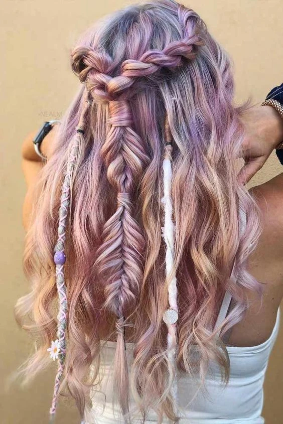 Multi Day Festival Hairstyles: Braided Updo with Floral Accents and Glitter for Day 3 A woman with a braided updo adorned with flowers and glitter for a multi day music festival