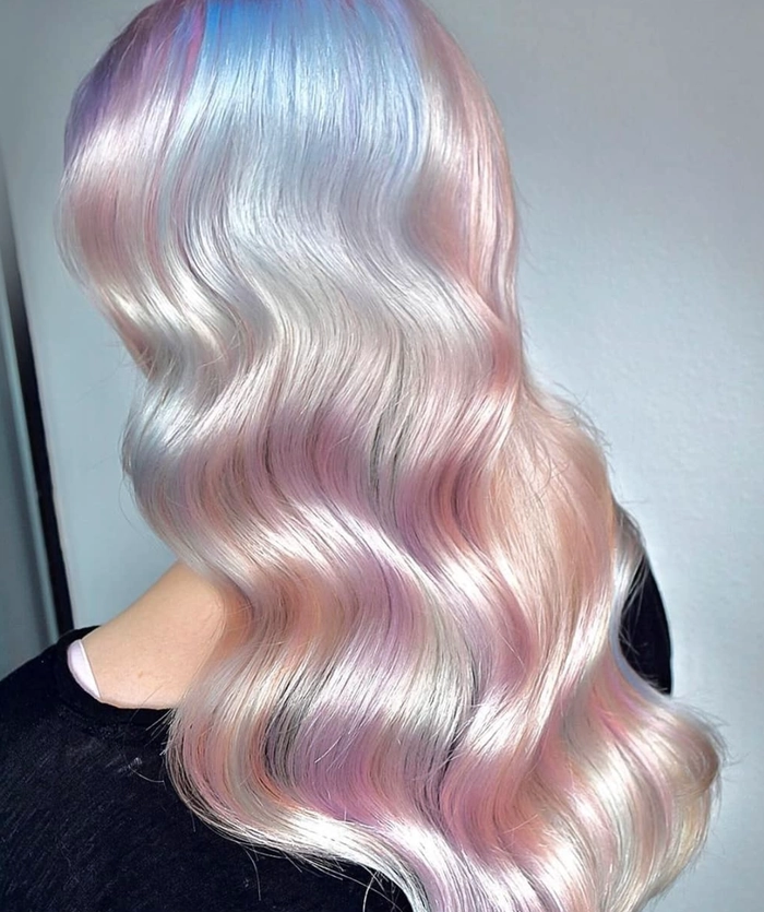 Pastel festival hairstyle with braids and flowers perfect for summer music events A festival hairstyle with pastel hair featuring intricate braiding and soft floral accessories