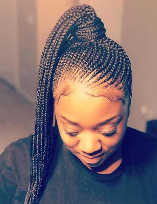 Braided Protective Festival Hairstyle with Decorative Accents Protective festival hairstyle with braids and colorful accessories