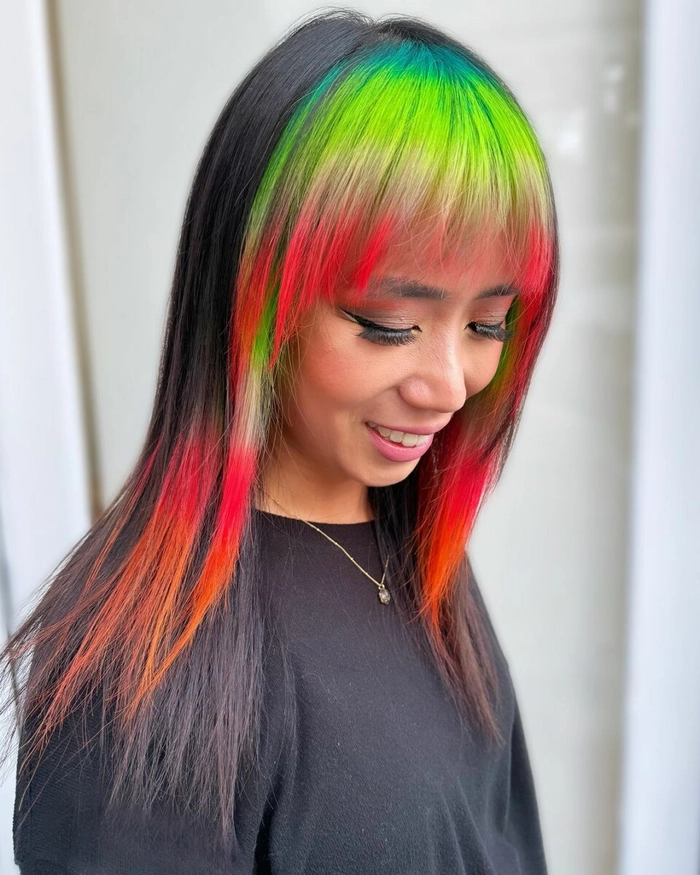 Rave festival hairstyle featuring glowing space buns Vibrant space buns with glitter and glow sticks for a rave festival look