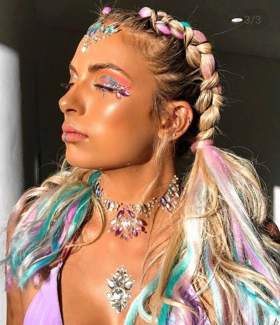 Rave festival hairstyles with bold neon braids and glitter Neon-colored braided updo with glitter accents at a rave festival