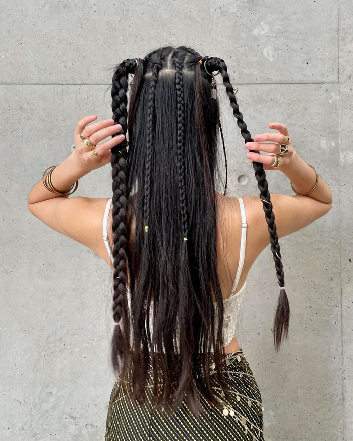 Neon Braids and Glitter Roots for Rave Festival Glam Vibrant braided hairstyle with colorful extensions and glowing accessories at a rave festival