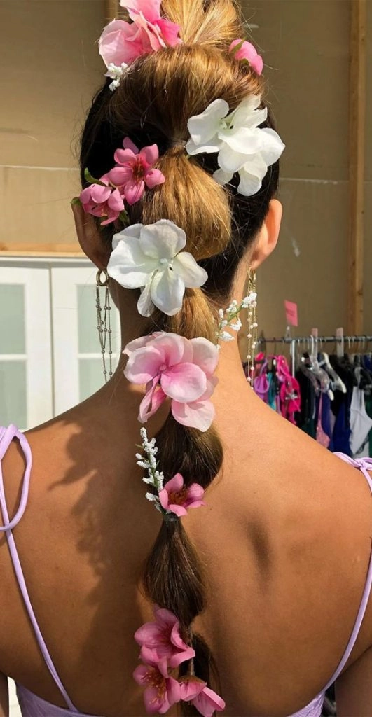 Romantic festival hairstyle with loose curls and a flower crown