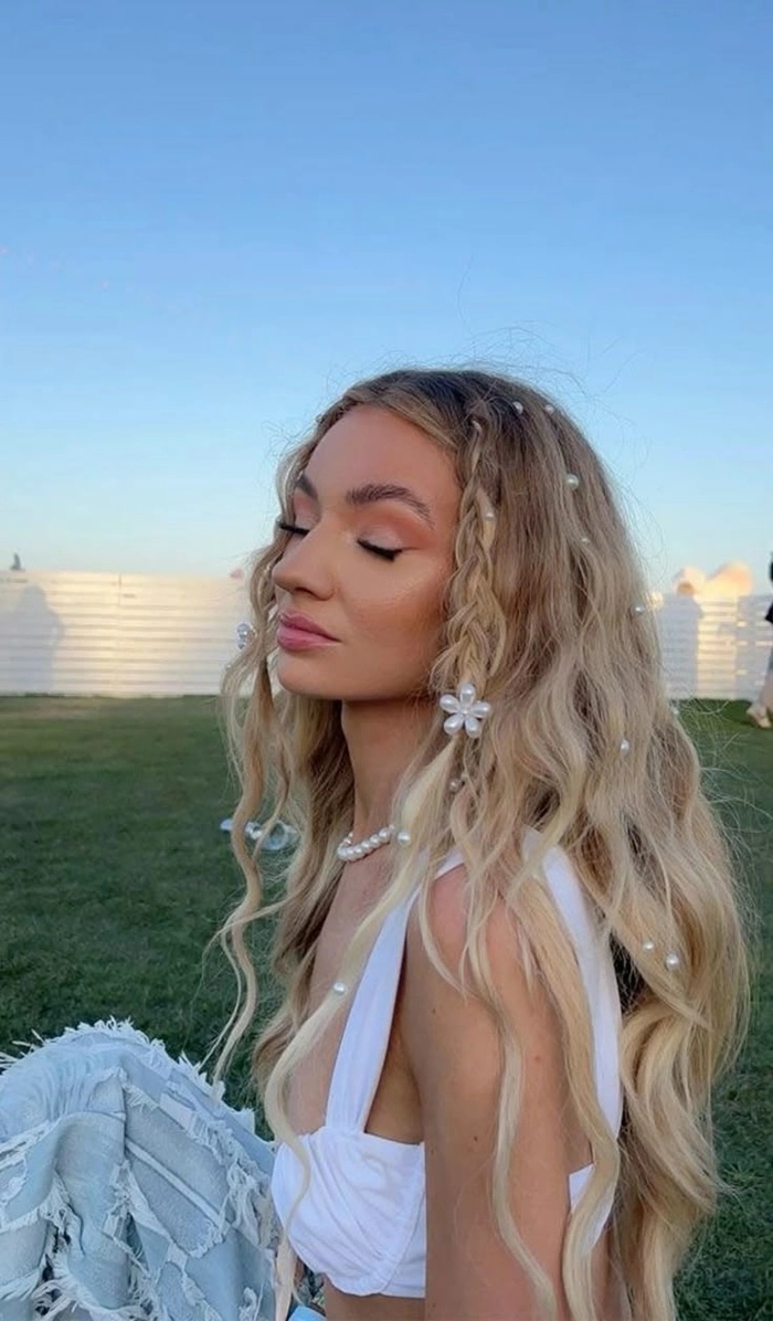 Creative Tomorrowland hairstyles featuring colorful braids and festival-ready hair art Boho braids with floral accents and glittering hair accessories at Tomorrowland festival