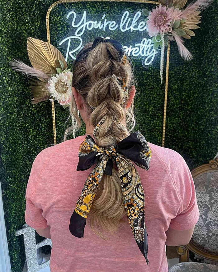 Wind proof festival hairstyle featuring twisted updo with bobby pins