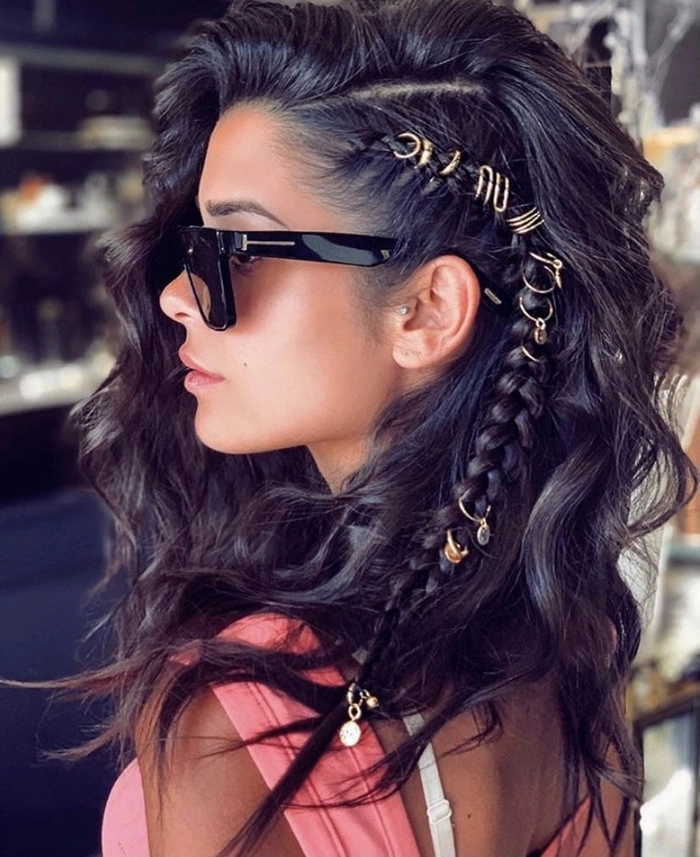 A woman at an outdoor festival showing off a wind-proof braided updo