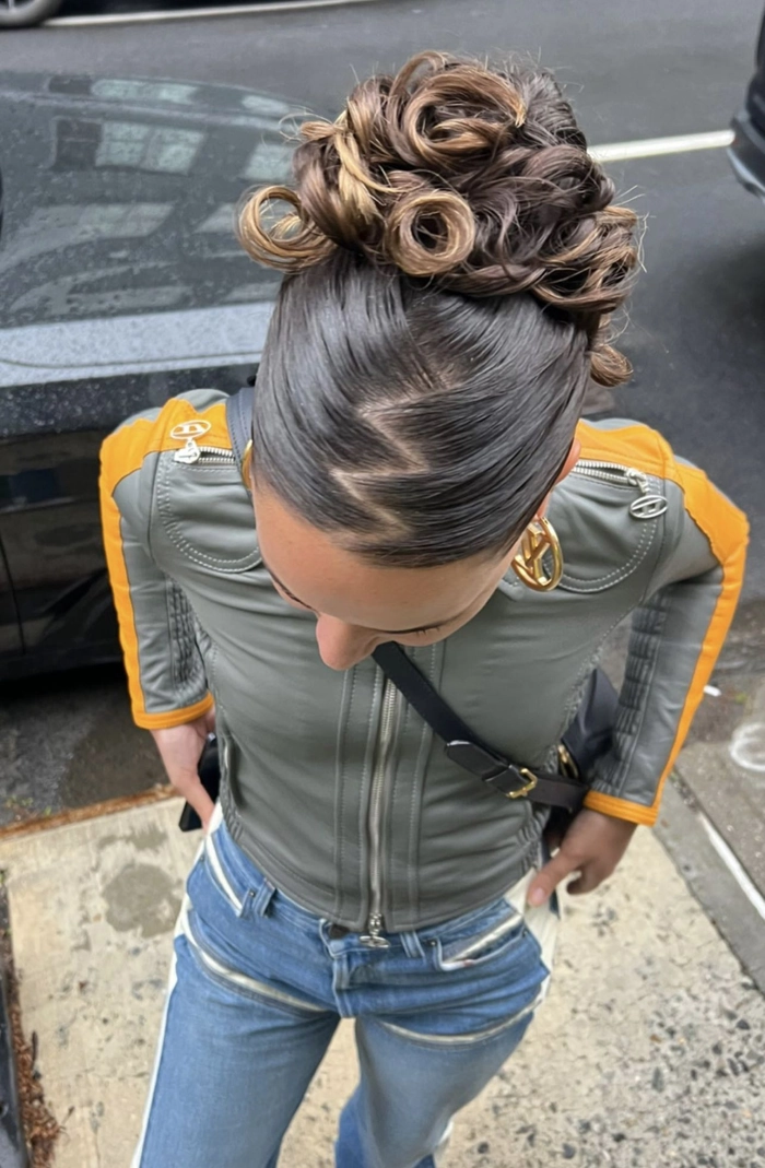 Retro Y2K festival hairstyle featuring butterfly clips and crimped texture Y2K festival hairstyle with butterfly clips and crimped waves