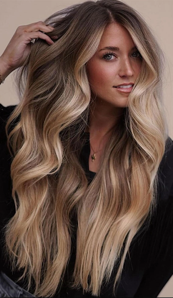 Beautiful balayage graduation hairstyle with subtle caramel and honey highlights Elegant balayage highlights framing a graduate's face with soft, sunlit tones