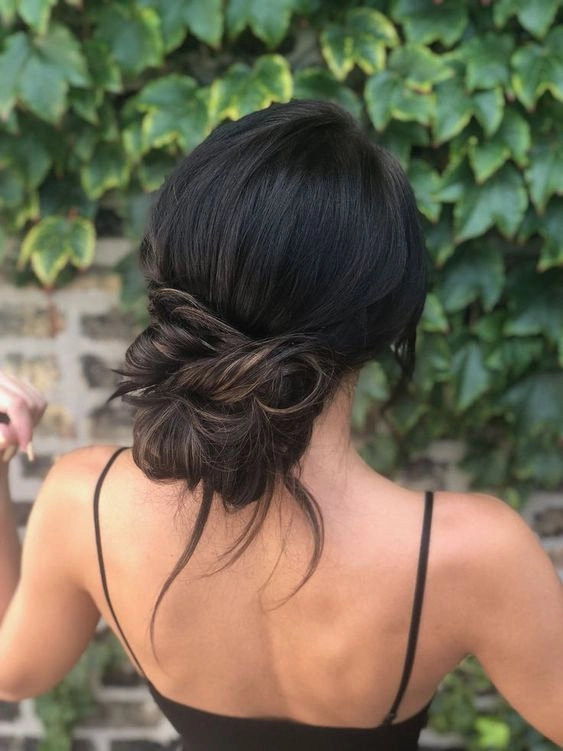 Choose the best hairspray for graduation day to keep your hairstyle flawless A graduate's smooth updo finished with strong hold hairspray for all-day wear