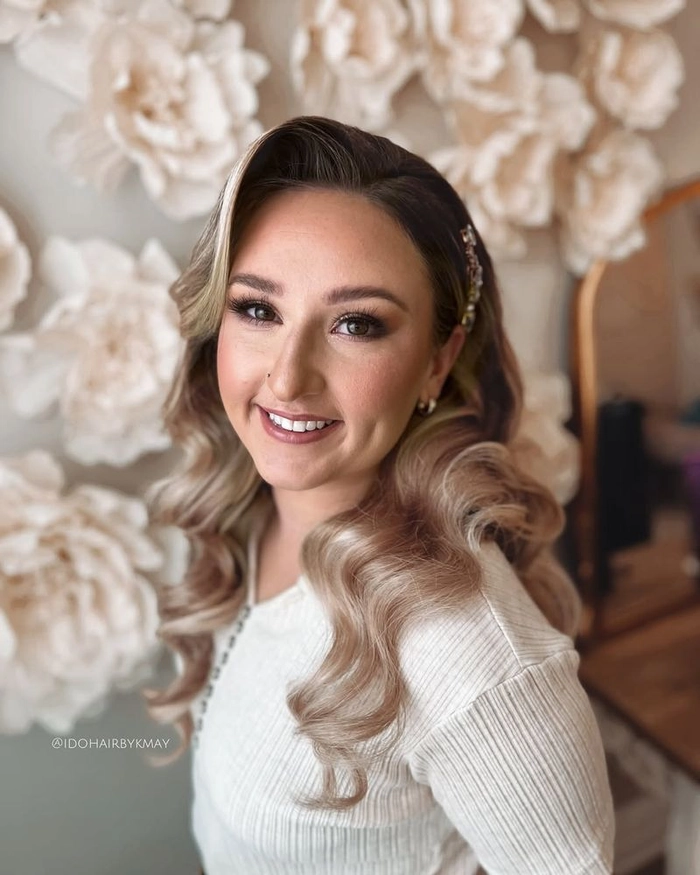 Boho chic graduation hair inspiration with braided crown and soft tendrils Boho chic graduation hairstyle with loose waves and floral accessories for a free-spirited look