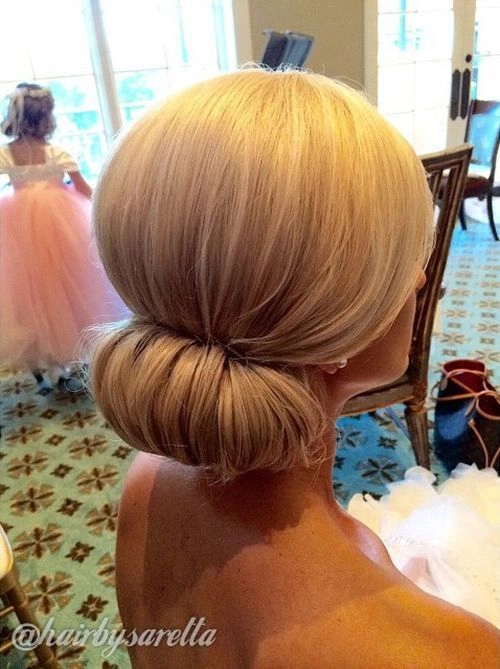 Elegant chignon bun graduation hairstyle styled for a sophisticated look under a cap